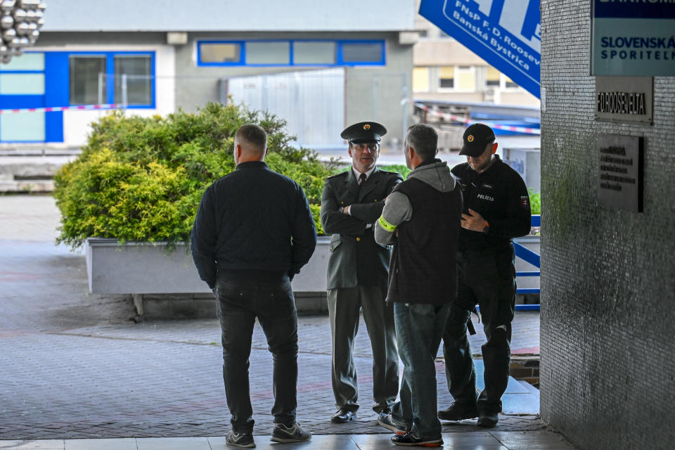 Policemen stand outside the F. D. Roosevelt University Hospital, where Slovak Prime Minister Robert Fico, who was shot and injured, is treated in Banska Bystrica, central Slovakia, Wednesday, May 15, 2024. Slovak Prime Minister Robert Fico is in life-threatening condition after being wounded in a shooting after a political event Wednesday afternoon, according to his Facebook profile.(AP Photo/Denes Erdos)