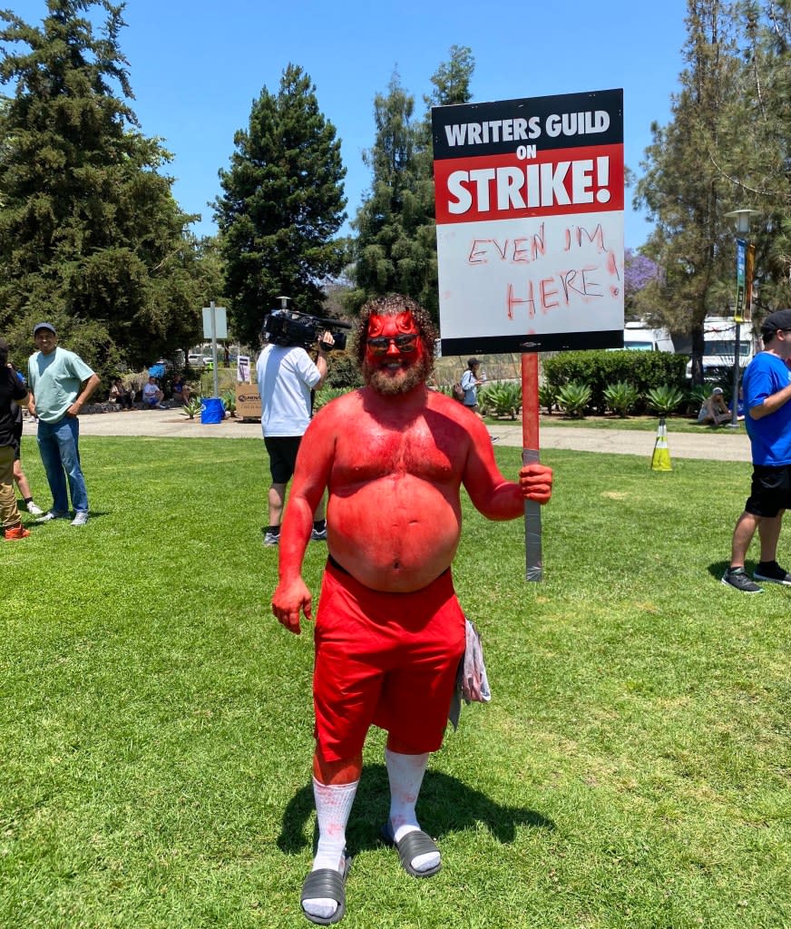 Actor Sebastian Fernandez stood out in the WGA rally crowd.