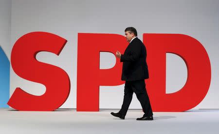 German Economy Minister and Leader of the Social Democratic Party (SPD) Sigmar Gabriel walks on the podium during the SPD party congress in Berlin, Germany, December 12, 2015. REUTERS/Fabrizio Bensch/files