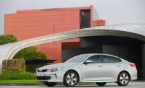 <p>Kia's mid-size Optima plug-in hybrid shares most of its powertrain and 9.8-kWh battery pack with the Hyundai Sonata PHEV, as well as its 27-mile electric-only range and approximately 600-mile total driving range between fill-ups. The Optima plug-in is also very heavy (426 pounds heavier than the regular Optima), so handling suffers, and passing acceleration is woeful. It inherits the Optima's innately good looks; however, sharp eyes will identify the plug-in model's creased bumpers, blueish-tinted windows, and unique grille with motorized shutters.</p><p><span><strong><em>Read More</em></strong></span></p>