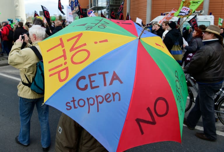 Protestors hold an umbrella reading "No TTIP" during a demonstration against the Trans-Atlantic Trade and Investment Partnership in Hanover, northern Germany