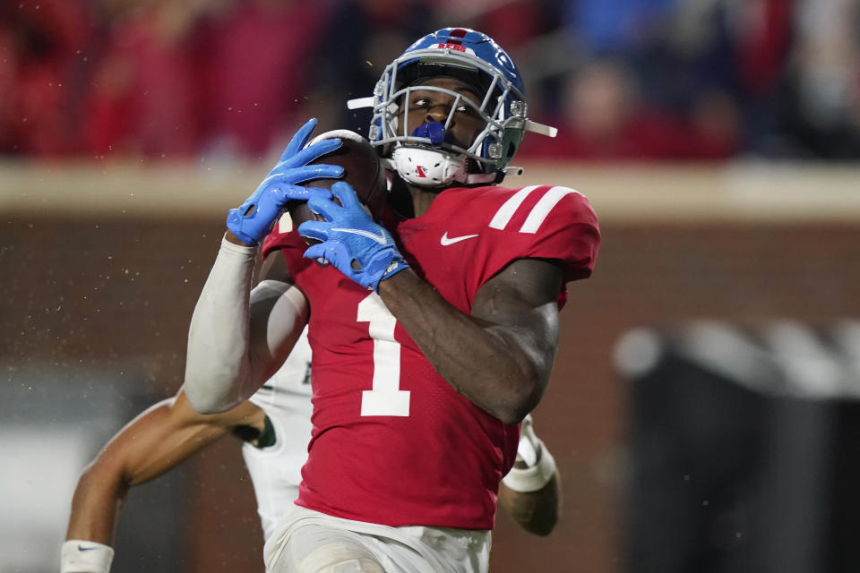 Mississippi wide receiver Jonathan Mingo (1) pulls in a pass for a 50-yard touchdown against Tulane during the first half of an NCAA college football game Saturday, Sept. 18, 2021, in Oxford, Miss. (AP Photo/Rogelio V. Solis)