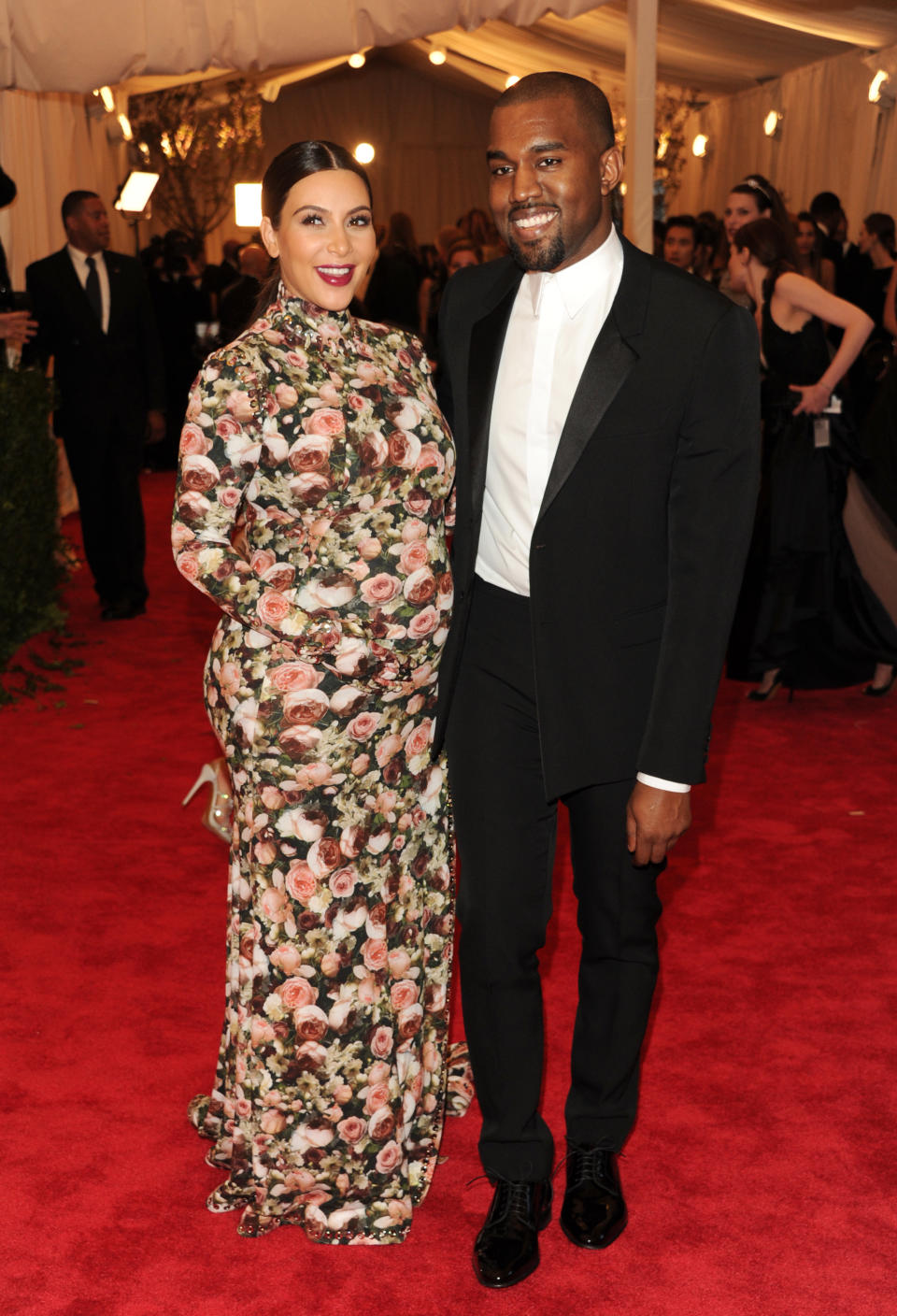 FILE - This May 6, 2013 file photo shows Kim Kardashian and Kanye West atThe Metropolitan Museum of Art's Costume Institute benefit celebrating "PUNK: Chaos to Couture" in New York. West had many righteous things to rage about this year, from the fashion industry not giving him credit for brilliant, life-changing designs like leather jogging pants to not getting respect from President Barack Obama. But nothing seemed to upset him more than Vogue's apparent refusal to put his baby mama, Kardashian, on their cover. (Photo by Evan Agostini/Invision/AP, File)