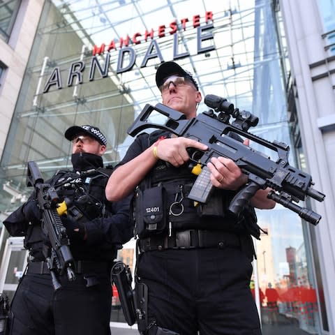 Armed police patrol Manchester's Arndale Shopping Centre following a stabbing assault on October 10.  - Credit: Paul Cousans/Zenpix