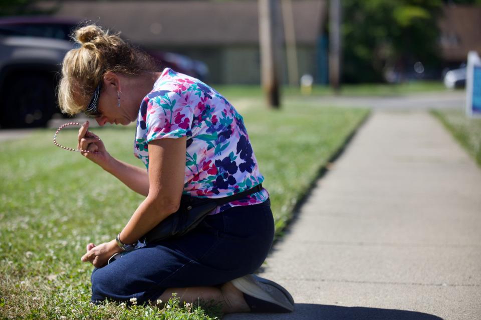 Mary Ann Berning of Kettering reacts to the fall of Roe v Wade Friday, June 24, 2022. She fell to her knees to pray just steps from the Women’s Med Center in Kettering.