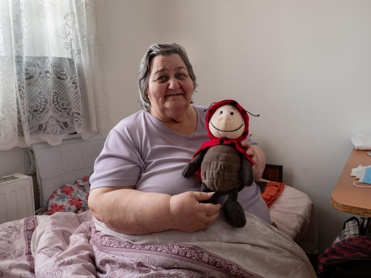 Tatianna, a Ukrainian refugee in Moldova, with a teddy bear that her grandson gave her.