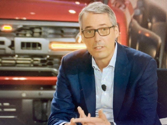 John Lawler, Ford chief financial officer, speaks from Dearborn in March 2022, when the automaker unveiled its plan to create Ford Blue and Ford Model e, two divisions designed to fuel electric vehicle and technology development.