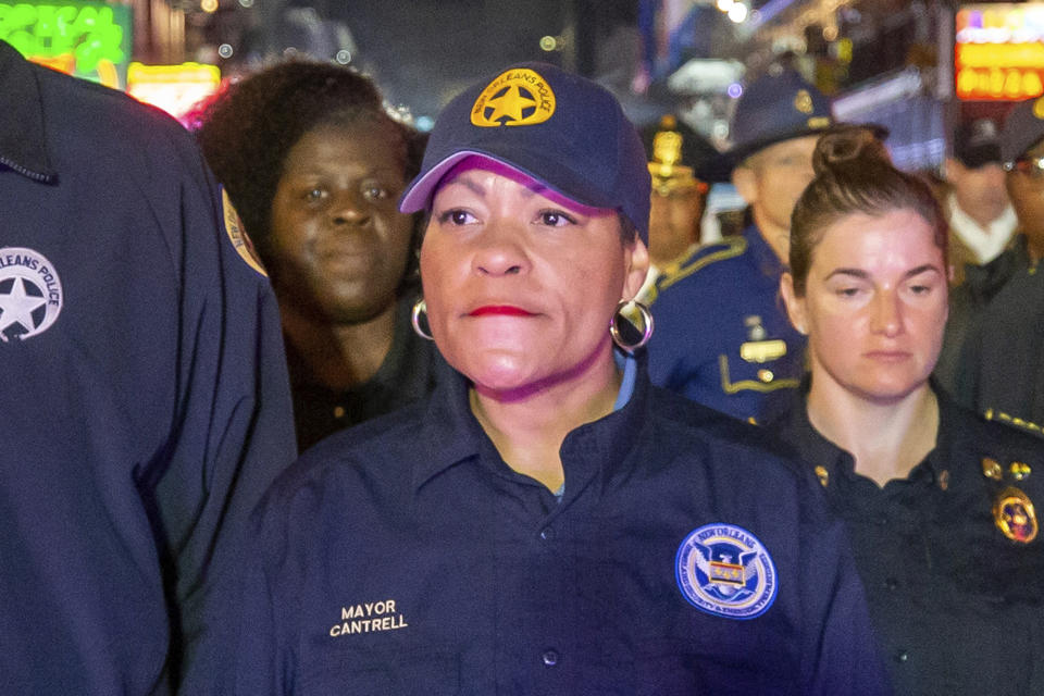 New Orleans Mayor LaToya Cantrell, center, along with other members of law enforcement, NOFD and EMS, walks down Bourbon Street just after midnight ceremoniously closing down Mardi Gras, Wednesday, Feb. 22, 2023, in New Orleans. Opponents of New Orleans Mayor LaToya Cantrell rushed 10 boxes of petitions into City Hall on Wednesday and declared they have enough enough signatures to force a recall of the second-term mayor. (David Grunfeld/The Times-Picayune/The New Orleans Advocate via AP)