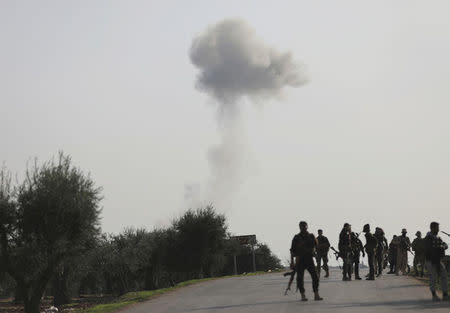 Smoke rises as Turkish-backed Free Syrian Army fighters advanced in north of Afrin, March 8. REUTERS/Khalil Ashawi