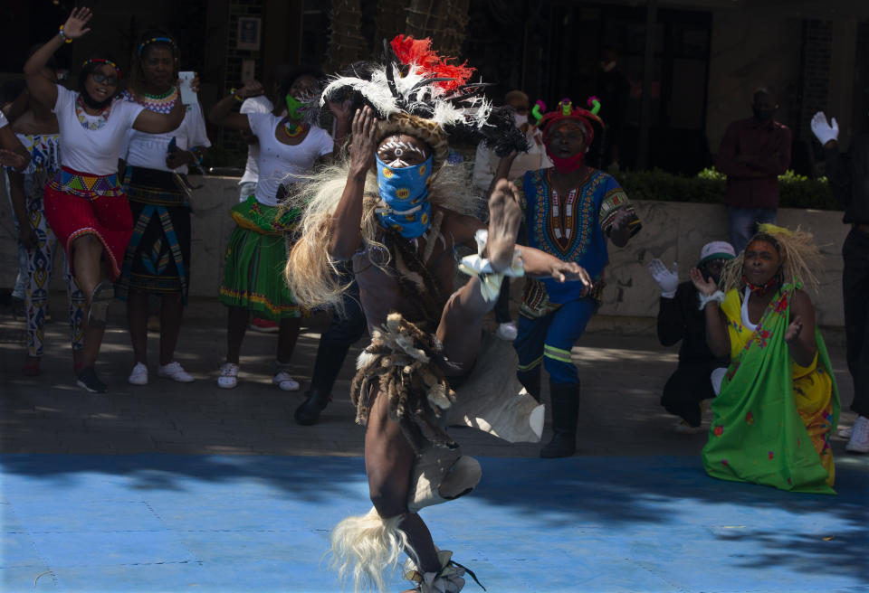 South Africans celebrate Heritage Day with song and dance at the Nelson Mandela Square in Johannesburg, Thursday Sept. 24, 2020. (AP Photo/Denis Farrell)