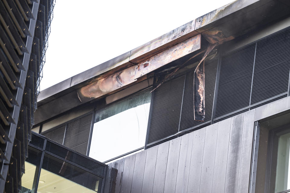 Damages caused by a fire are seen in the building housing the Danish Taxation Ministry, in Copenhagen, Denmark, Thursday June 27, 2024. A fire on Thursday broken out on top of a building housing Denmark’s Taxation Ministry in downtown Copenhagen, leading to the evacuation of the people inside the harbor-front glass-and-steel constrution and from adjacent houses. There was no word on casulaties.(Martin Sylvest/Ritzau Scanpix via AP)