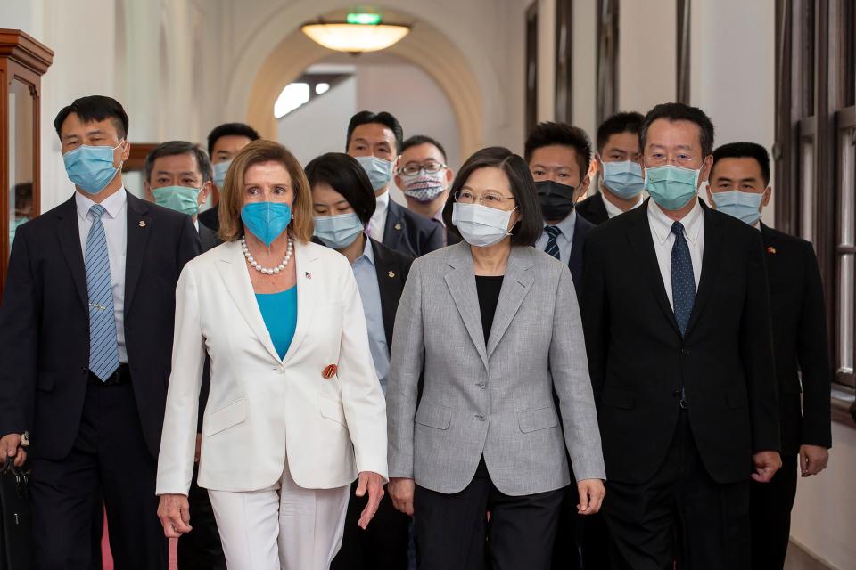 In this photo released by the Taiwan Presidential Office, U.S. House Speaker Nancy Pelosi, left, and Taiwanese President President Tsai Ing-wen arrive for a meeting in Taipei, Taiwan, Wednesday, Aug. 3, 2022.