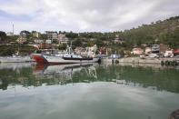 Vessels are docked at the port of Shengjin, northwestern Albania, on Tuesday, Nov. 7, 2023. Italian Premier Giorgia Meloni announced that Albania had agreed to give temporary shelter to thousands of migrants who try to reach Italian shores while their asylum bids are being processed. Albania will offer two facilities, a quarantine area at the port of Shengjin and an accommodation center for those who will be deported at a former military airport in Gjader. (AP Photo/Armando Babani)