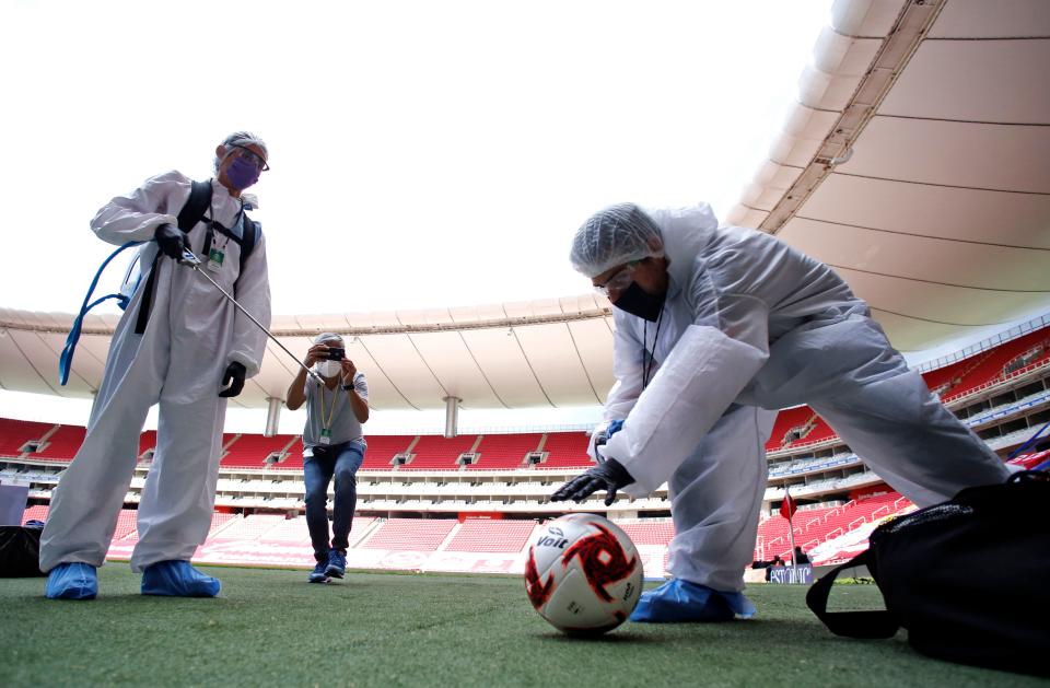 Footballs are sanitized before the Copa por Mexico pre-season football tournament match between Atlas and Tigres, at the Akron stadium in Zapopan, Metropolitan Guadalajara, Jalisco State, Mexico, on July 12, 2020, amid the COVID-19 novel coronavirus pandemic. - The tournament is played without spectators as a preventive measure against the spread of COVID-19. (Photo by Ulises RUIZ / AFP) (Photo by ULISES RUIZ/AFP via Getty Images)