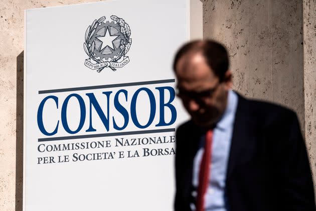 This illustration picture taken on June 14, 2019 shows a man walking past a logo of Consob (Commissione Nazionale per la Societa' e la Borsa, National Commission for companies and stock exchange) as he arrives for the annual meeting with financial market in Palazzo Mezzanotte in Milan. (Photo by MARCO BERTORELLO / AFP)        (Photo credit should read MARCO BERTORELLO/AFP via Getty Images) (Photo: MARCO BERTORELLO via Getty Images)