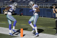 Dallas Cowboys wide receiver Ced Wilson, right, celebrates with wide receiver Michael Gallup, left, after Wilson scored a touchdown during the second half of an NFL football game against the Seattle Seahawks, Sunday, Sept. 27, 2020, in Seattle. (AP Photo/John Froschauer)