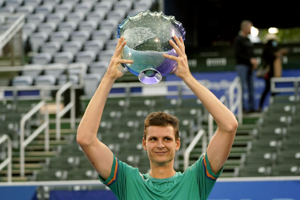 Hubert Hurkacz of Poland, holds the trophy after defeating Sebastian Korda 6-3, 6-3 during the men's singles final of the Delray Beach Open tennis tournament, Wednesday, Jan. 13, 2021, in Delray Beach, Fla. (AP Photo/Lynne Sladky)