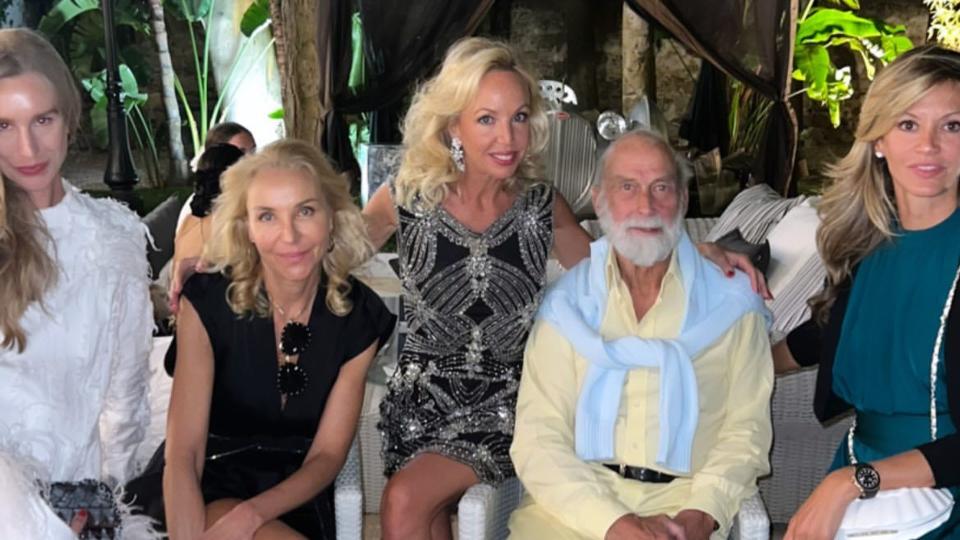 Prince Michael of Kent posing with friends at a party