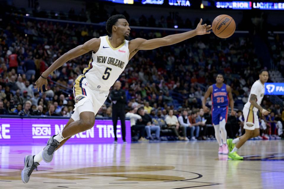 New Orleans Pelicans forward Herbert Jones reaches for the ball during the first half of the team's NBA basketball game against the Detroit Pistons in New Orleans, Thursday, Nov. 2, 2023. (AP Photo/Matthew Hinton)