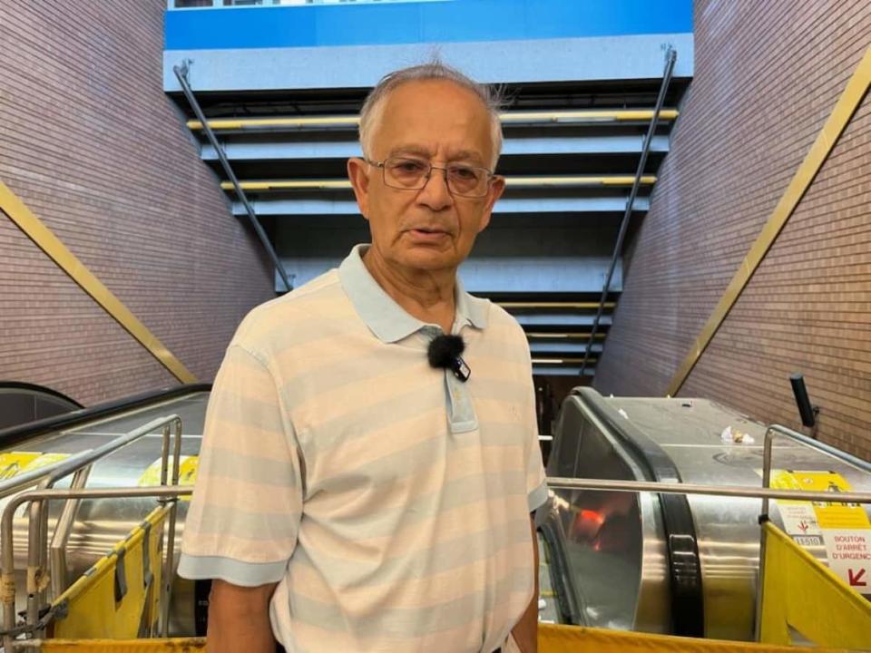 Retired engineer Arup Dutta says he is tired of having to take the stairs at the Côte-Vertu Metro station because of broken escalators. (Paula Dayan-Perez/CBC. - image credit)