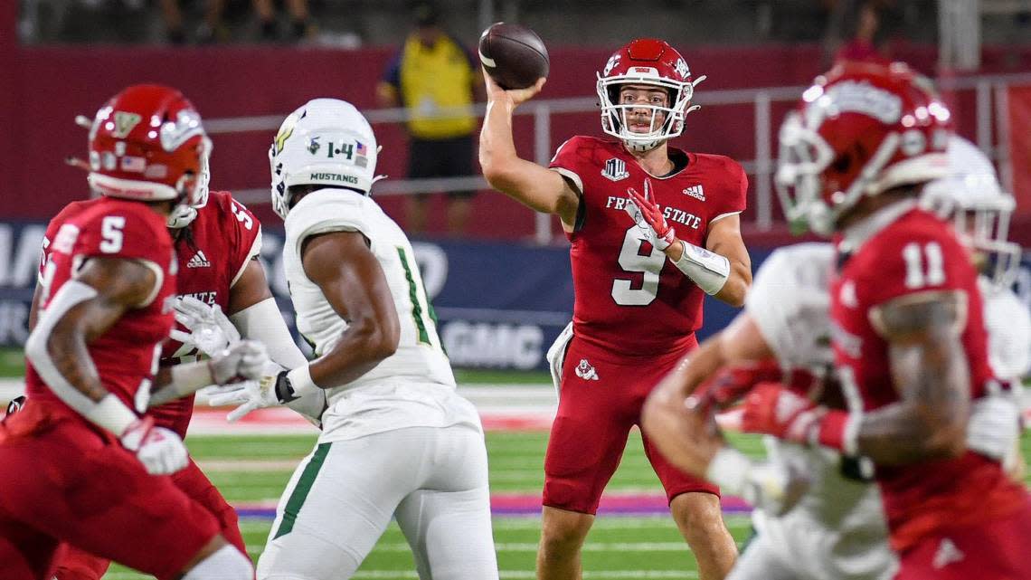 Fresno State quarterback Jake Haener throws to Jalen Moreno-Cropper, left, during their game at Valley Children’s Stadium on Thursday, Sept. 1, 2022.