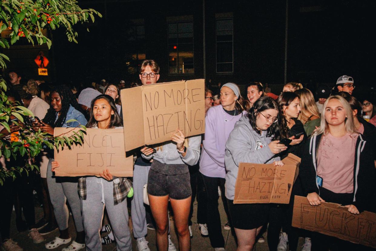 Protesters scream outside of the Phi Gamma Delta house in October.