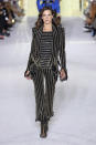 <p>The VS vet looked chic in stripes on Balmain's Paris Fashion Week runway.</p>