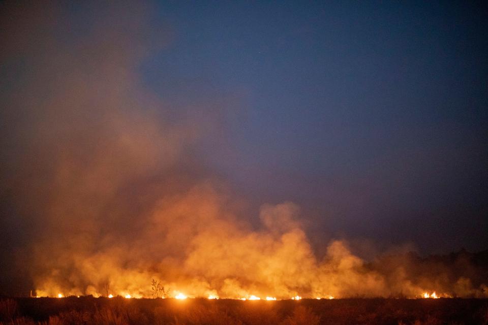 A fire burns out of control after spreading onto a farm along a highway in Nova Santa Helena municipality in northern Mato Grosso State, south in the Amazon basin in Brazil, on Aug. 23, 2019. (Photo: Joao Laet/AFP/Getty Images)