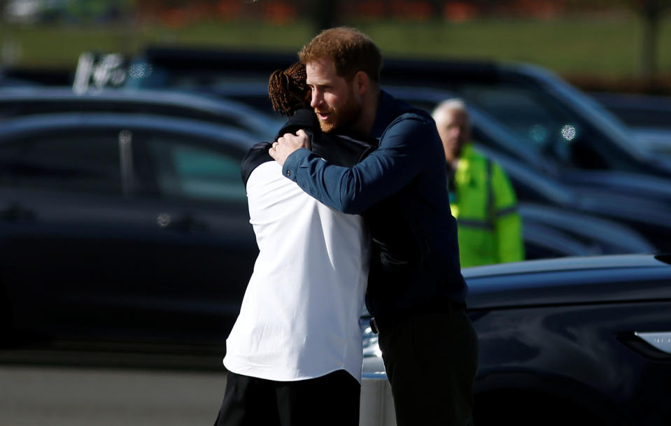 NORTHAMPTON, ENGLAND - MARCH 06: Prince Harry, Duke of Sussex embraces Formula One World Champion Lewis Hamilton as he officially opens The Silverstone Experience at Silverstone on March 6, 2020 in Northampton, England. (Photo by Peter Nicholls-WPA Pool/Getty Images)