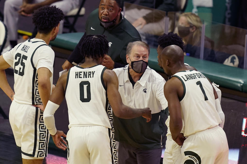 Michigan State head coach Tom Izzo talks to team members during the second half of an NCAA college basketball game against Michigan, Sunday, March 7, 2021, in East Lansing, Mich. (AP Photo/Carlos Osorio)