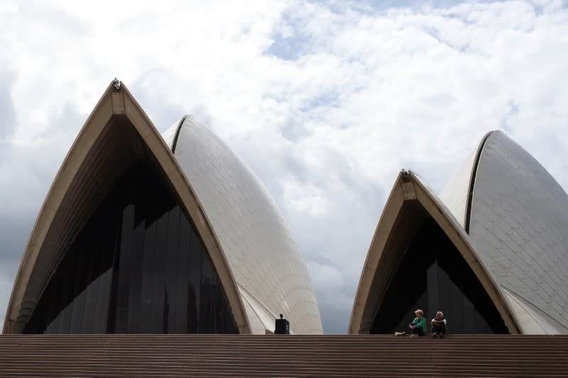 NPeople are seen on the nearly deserted steps of the Sydney Opera House
