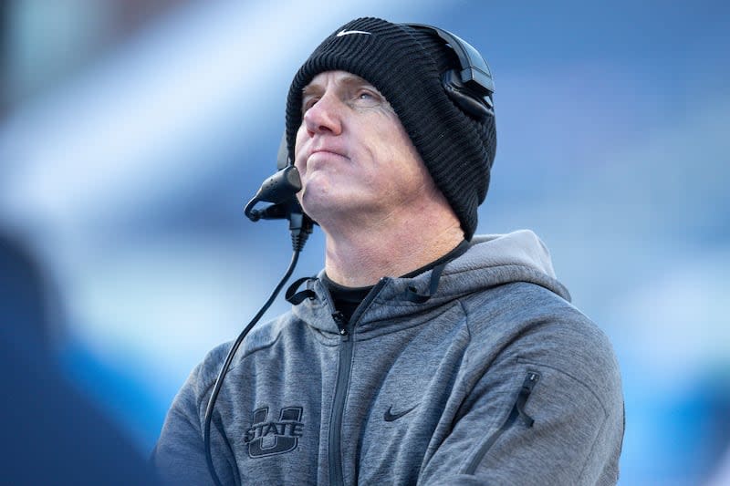 Utah State coach Blake Anderson looks at the videoboard late in the second half of the famous NCAA Idaho Potato Bowl college football game against Georgia State, Saturday, Dec. 23, 2023, in Boise, Idaho.  (AP Photo/Steve Conner) |  Steve Conner, Associated Press