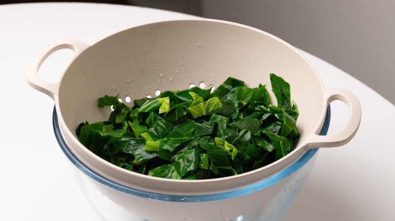 collard greens in a colander 