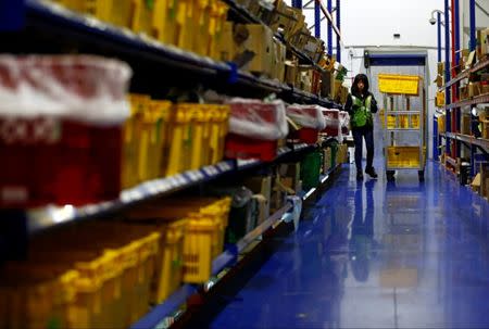 A employee works at RedMart's fulfillment centre in Singapore September 22, 2017. REUTERS/Edgar Su