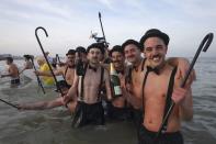 People wearing costumes participate in a traditional New Year's Day swim in Malo-les-Bains, northern France January 1, 2015. REUTERS/Pascal Rossignol (FRANCE - Tags: ANNIVERSARY SOCIETY)