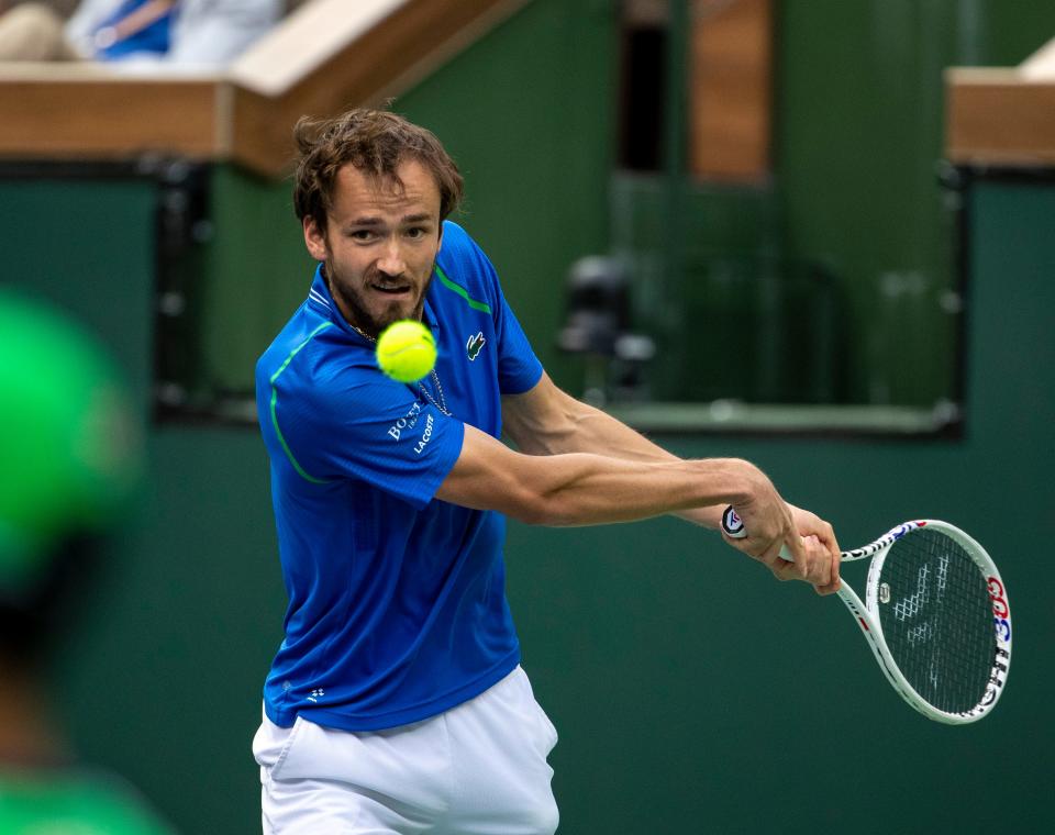 Daniil Medvedev of Russia returns to Carlos Alcaraz of Spain during the men's singles final at the BNP Paribas Open of the Indian Wells Tennis Garden in Indian Wells, Calif., Sunday, March 19, 2023. 