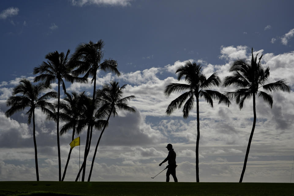 Sahith Theegala walks across the 17th green during the pro-am round at the Sony Open golf event, Wednesday, Jan. 10, 2024, at Waialae Country Club in Honolulu. (AP Photo/Matt York)