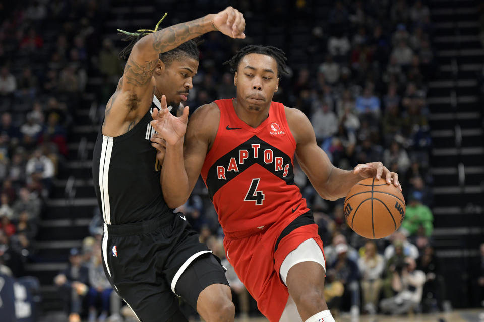 Toronto Raptors forward Scottie Barnes (4) drives against Memphis Grizzlies guard Ja Morant during the second half of an NBA basketball game Wednesday, Jan. 3, 2024, in Memphis, Tenn. (AP Photo/Brandon Dill)