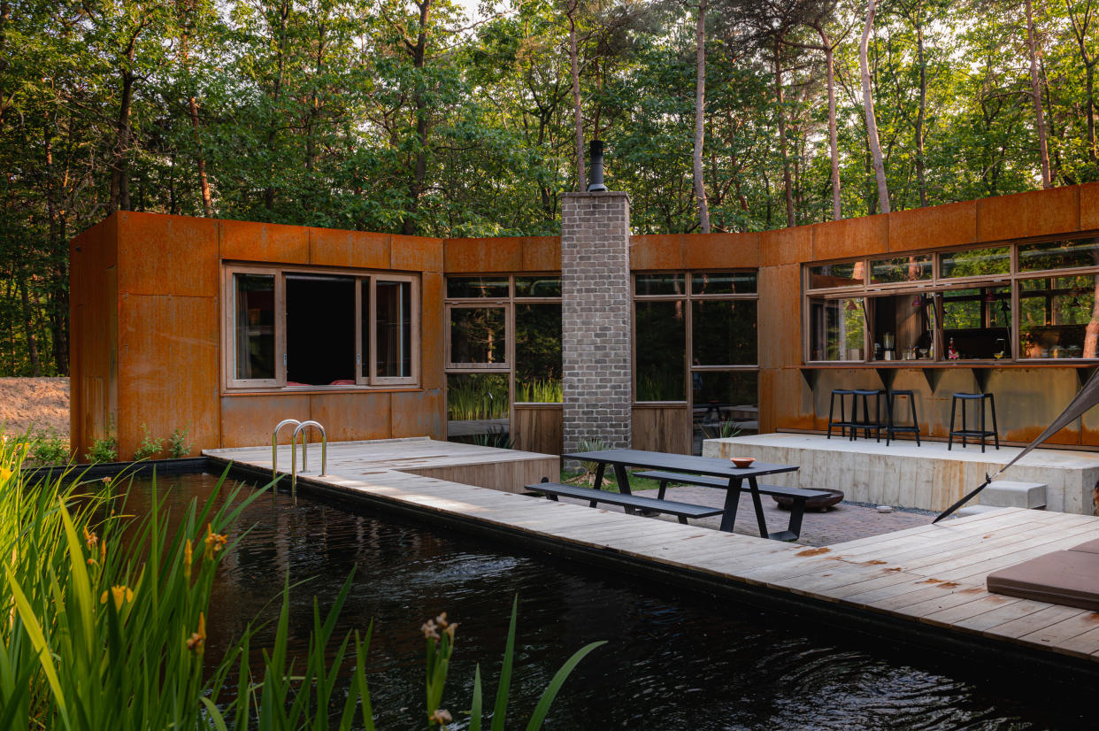  A natural pool with corten steel building 