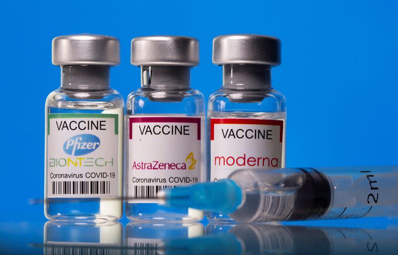 FILE PHOTO: Picture illustration of vials with Pfizer-BioNTech, AstraZeneca, and Moderna coronavirus disease (COVID-19) vaccine labels