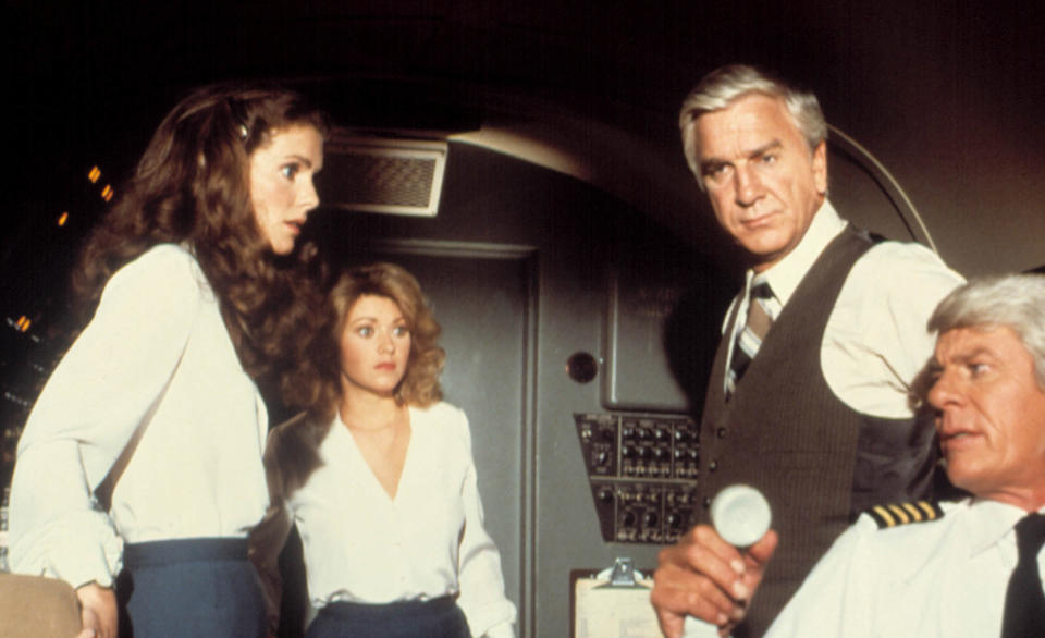 Hagerty, Patterson, Leslie Nielsen and Peter Graves in a scene from Airplane! (Courtesy Paramount/Everett Collection)