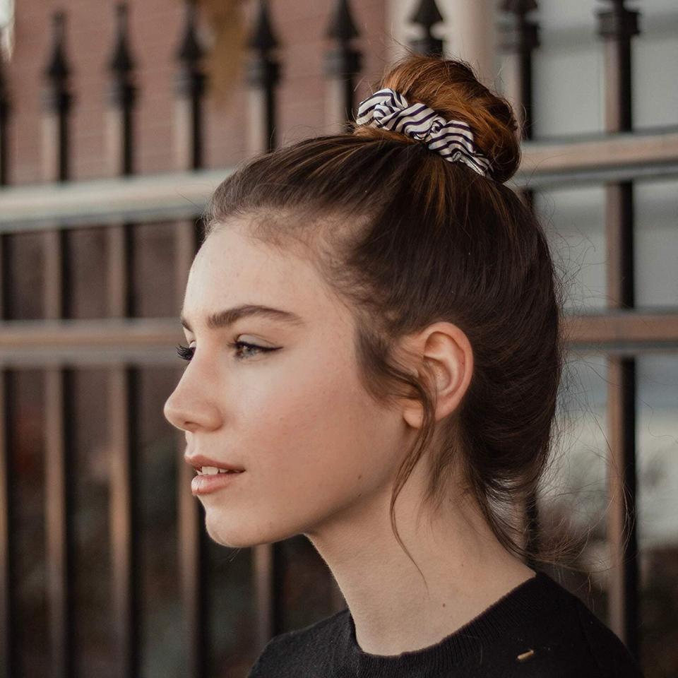 You might be thinking: scrunchies, seriously? But this was the year I decided to give my hair a break &mdash; I didn't stress too much about what it looked like. So, I had it up in a ponytail <i>a lot</i>. So I wanted to find hair ties that wouldn't be too heavy-handed on my locks but kept them away from my face. These <a href="https://amzn.to/3rfWfIx" target="_blank" rel="noopener noreferrer">satiny scrunchies</a> are as close to perfection as I could find. They haven't stretched out and don't get caught up in my curls. The scrunchies aren't too big, either &mdash; the <a href="https://www.whowhatwear.com/big-scrunchie-trend" target="_blank" rel="noopener noreferrer">very oversized scrunchie trend</a> isn't for me. With black and white stripes, they go with just about any outfit, too. <strong>&mdash; Pardilla <br /></strong><br /><a href="https://amzn.to/3rfWfIx" target="_blank" rel="noopener noreferrer"> Find the set for $9 at Amazon</a>.