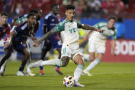 Austin FC forward Sebastián Driussi, center, scores on a penalty kick goal during the second half of an MLS soccer match against FC Dallas, Saturday, May 11, 2024, in Frisco, Texas. (AP Photo/LM Otero)