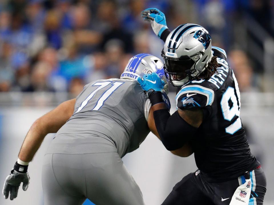 Julius Peppers sheds a block against the Detroit Lions.