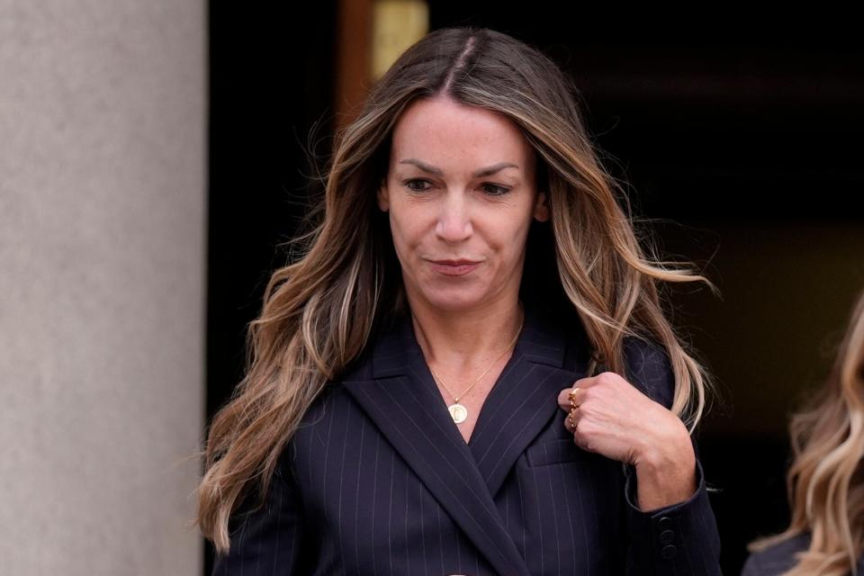 Karen Read leaves Norfolk Superior Court after the opening day of her trial, Monday, April 29, 2024, in Dedham, Mass. Read is charged with killing her Boston police officer boyfriend by intentionally driving her SUV into him. (AP Photo/Charles Krupa)