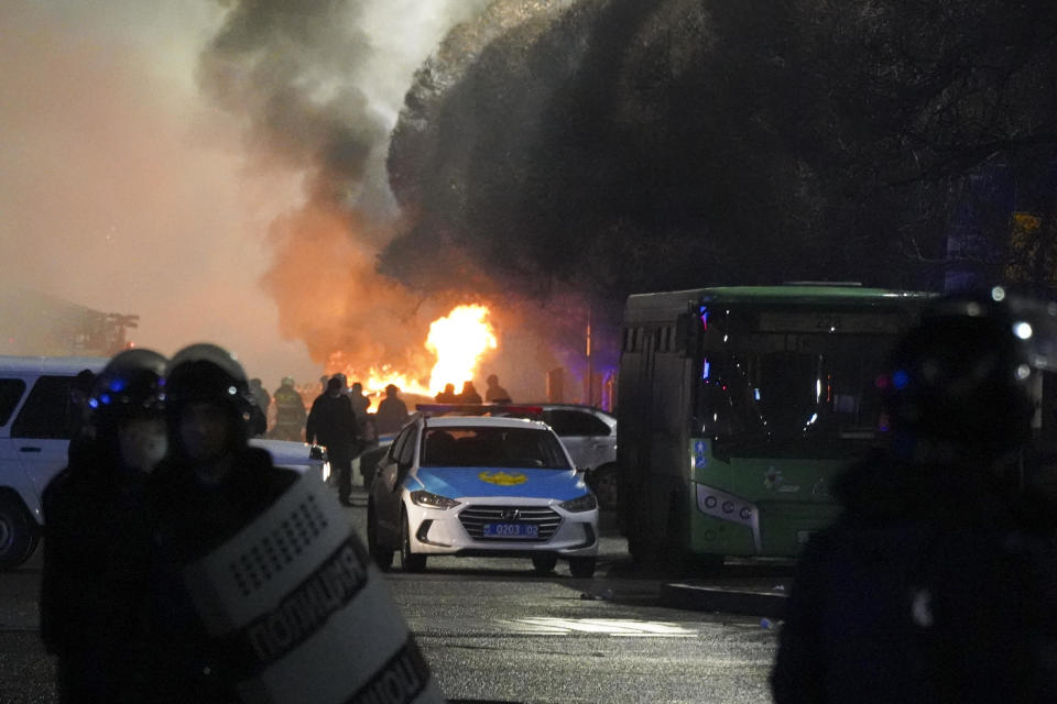 A police vehicle is seen on fire during clashes with protesters in the center of Almaty, Kazakhstan, January 5, 2022. / Credit: Vladimir Tretyakov/AP