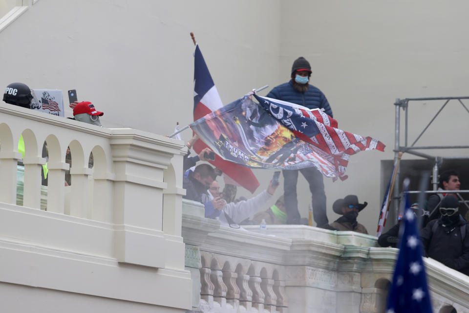 WASHINGTON, DC - JANUARY 06: Protesters gather on the U.S. Capitol Building on January 06, 2021 in Washington, DC. Pro-Trump protesters entered the U.S. Capitol building after mass demonstrations in the nation's capital during a joint session Congress to ratify President-elect Joe Biden's 306-232 Electoral College win over President Donald Trump. (Photo by Tasos Katopodis/Getty Images)