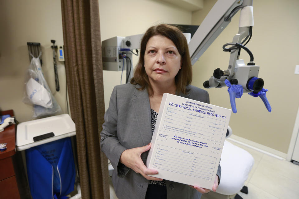 Director of the forensic nursing program at the Bon Secours St. Mary's Hospital, Bonnie Price, holds an evidence kit in the examination room at the hospital in Richmond, Va., Wednesday, Oct. 30, 2019. A nationwide shortage of sexual assault nurse examiners means that rape victims are often forced to drive from hospital to hospital to find someone trained to examine them. (AP Photo/Steve Helber)