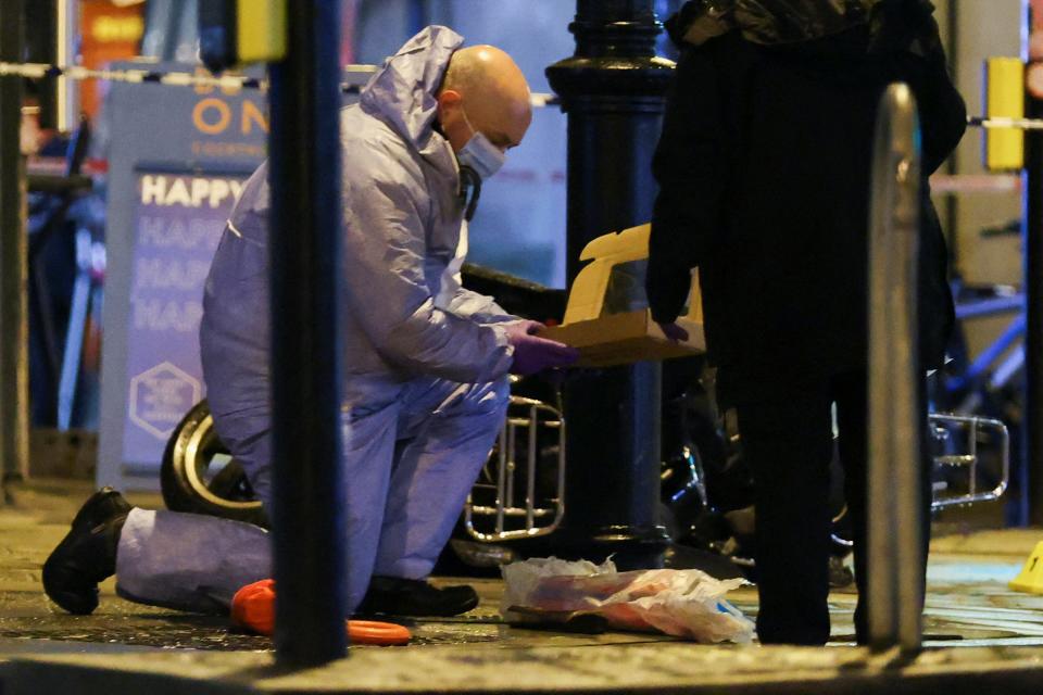 A police forensic officer works at the site of an incident in south London (REUTERS)