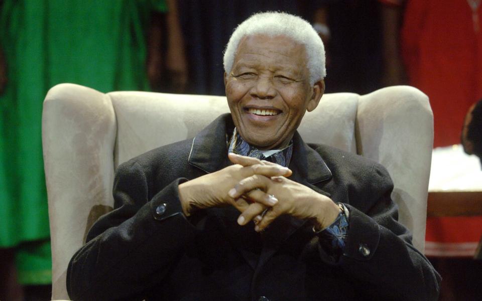 Former South African President Nelson Mandela sits at the Annual Nelson Mandela Lecture on July 12, 2008 in Soweto - Credit: AFP